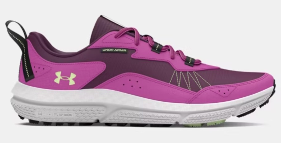 a women's Under Armour running shoe in fuschia pink and purple with white and grey accents