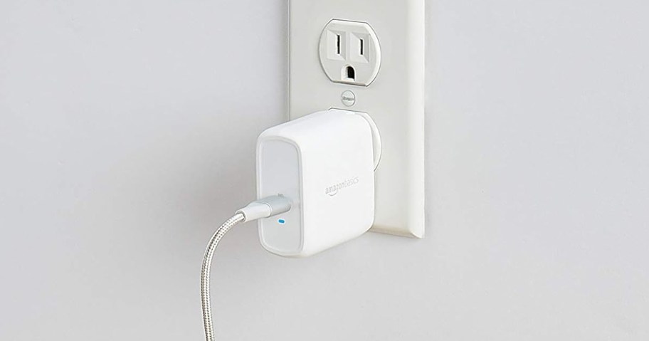 white charging block plugged into an outlet