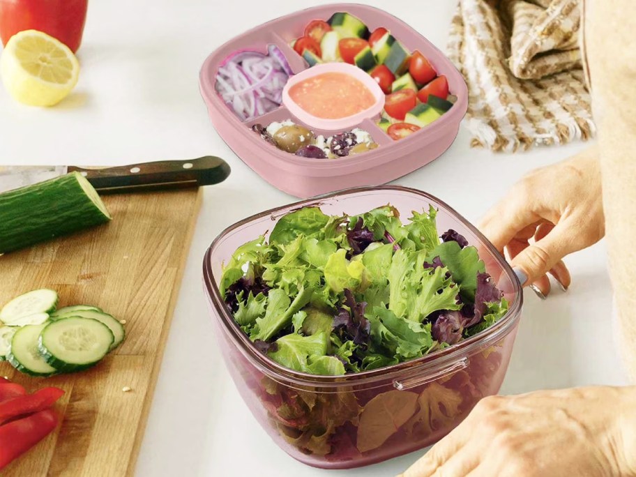 prepping salad in a purple glass container