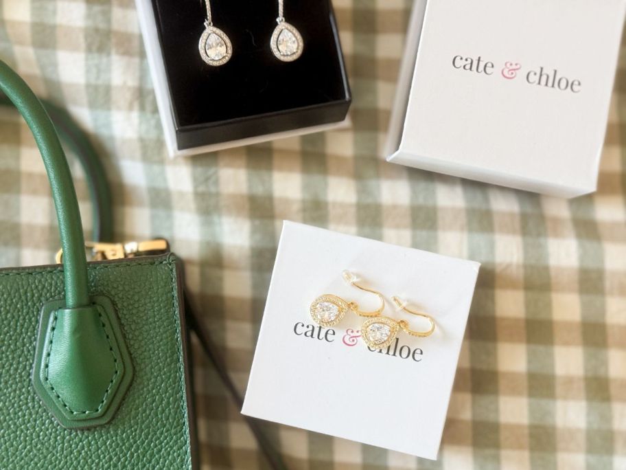 Boxes with Cate & Chloe Isabel Earrings in them and on them