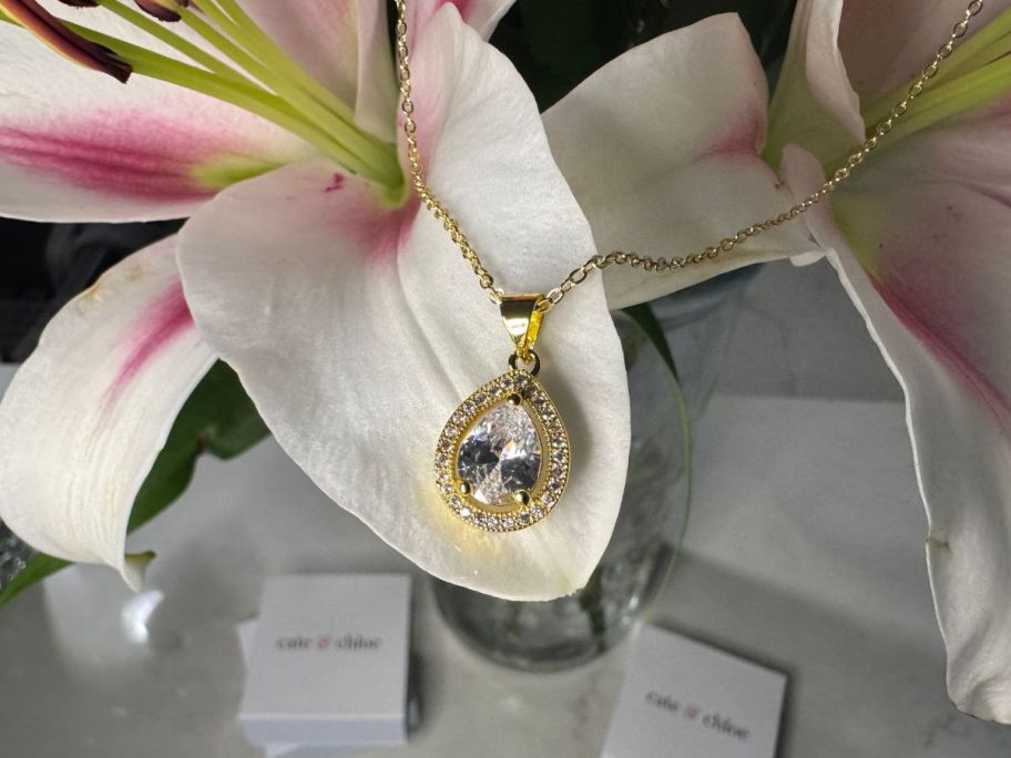 Close up view of a Cate & Chloe Isabel Necklace in Yellow Gold