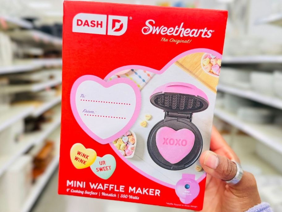 hand holding a Sweethearts Mini Waffle Maker