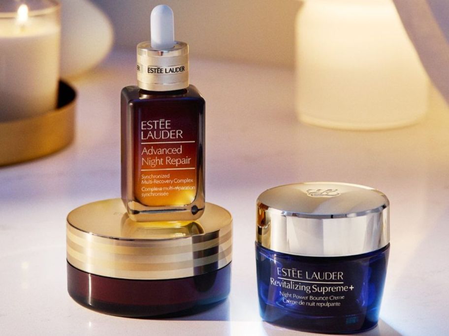 A bottle of Estee Lauder Advanced Night Repair Serum and a jar of Revitalizing Supreme+ Night Repair Cream