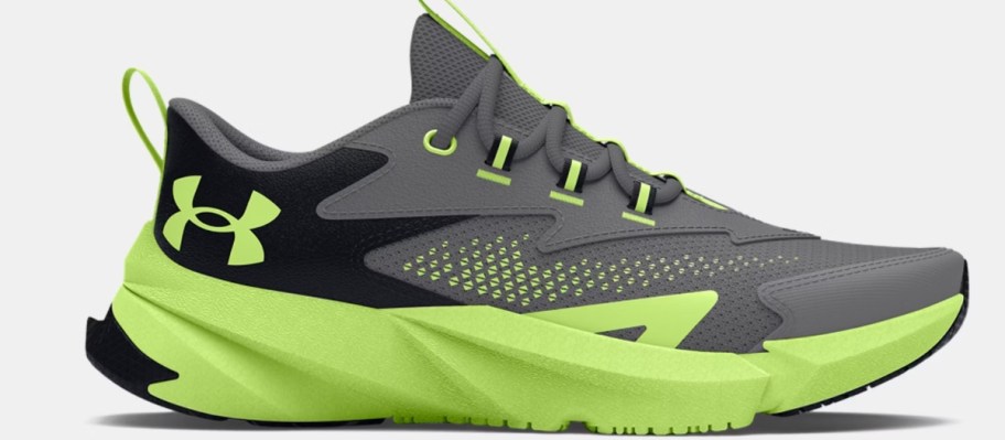 a boy's Under Armour running shoe in grey with neon yellow and black accents