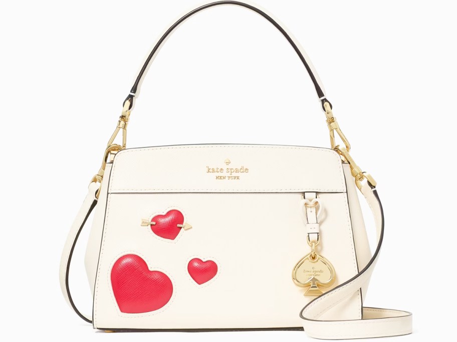 white purse with red heart print