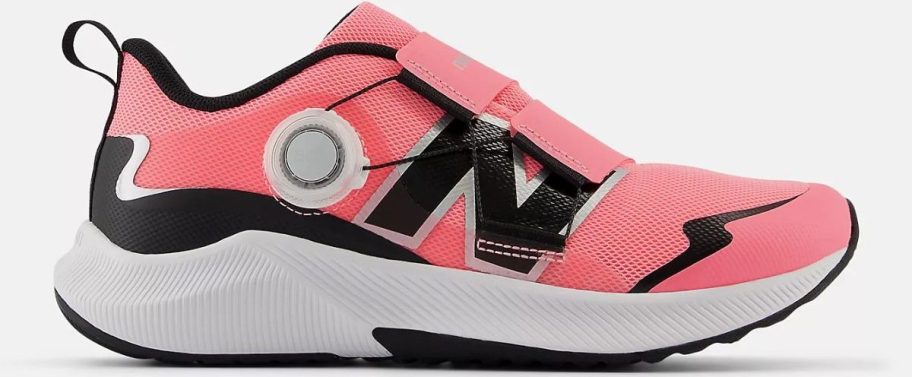 a pink kids running shoe