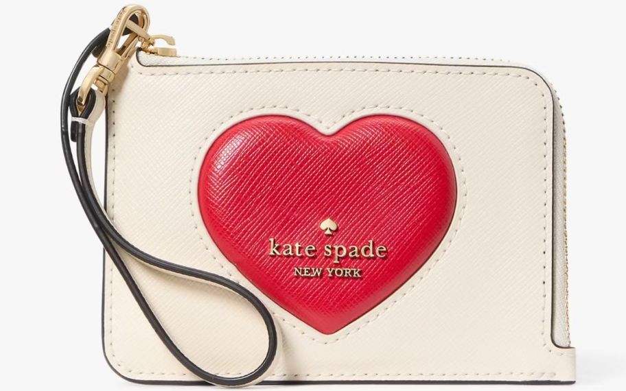 a small wristlet with a red puffy heart and wrist strap