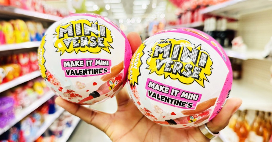 hand holding up Make It Mini Valentine's balls