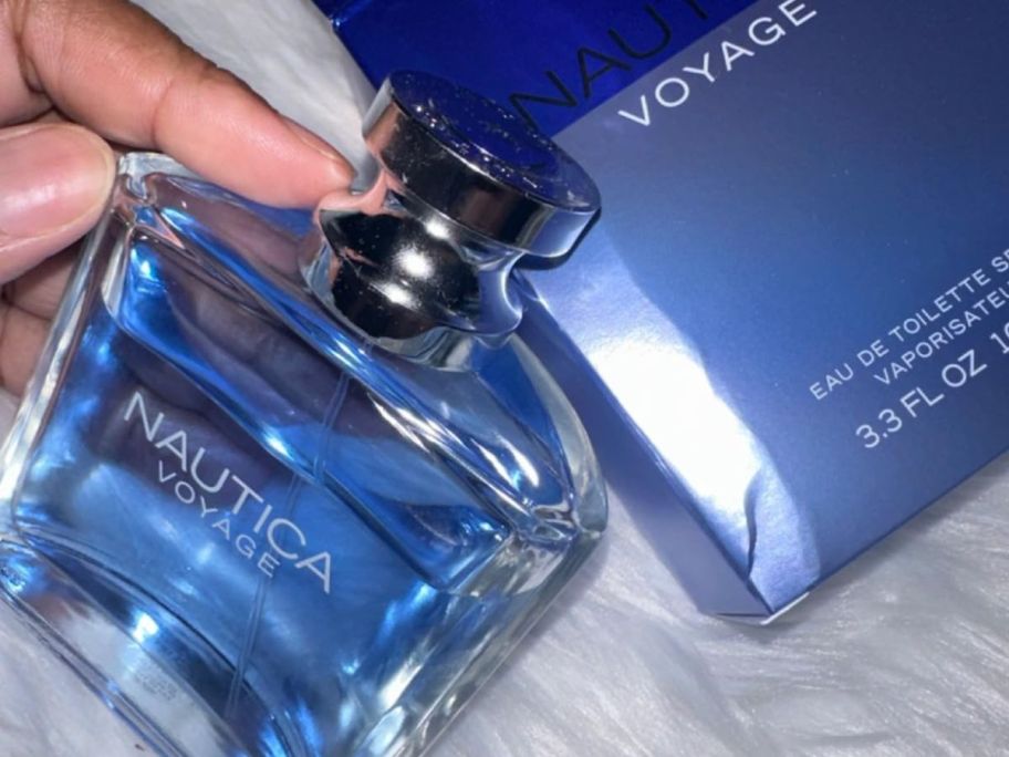 Nautica Voyage Colagon holds a bottle of bottle