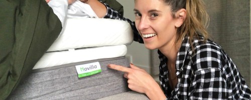woman pointing to corner of novilla mattress