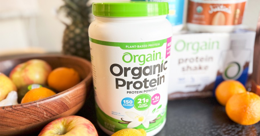 jar of Orgain Organic Vegan Vanilla Bean Protein Powder on kitchen counter