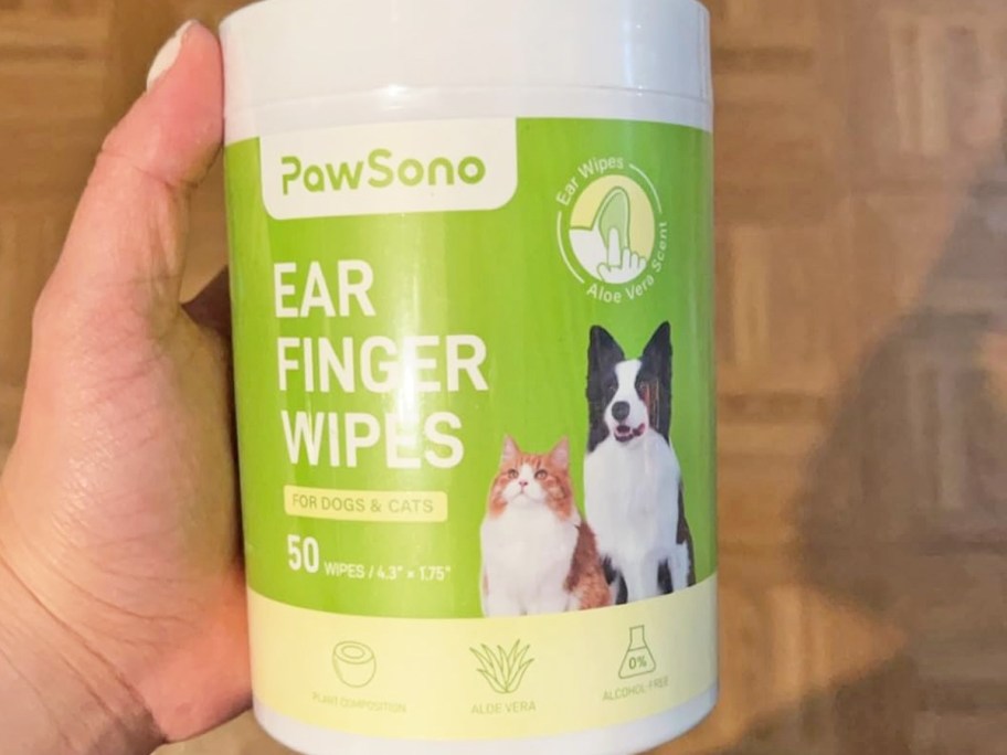 hand holding a container of PawSono Pet Ear Finger Wipes