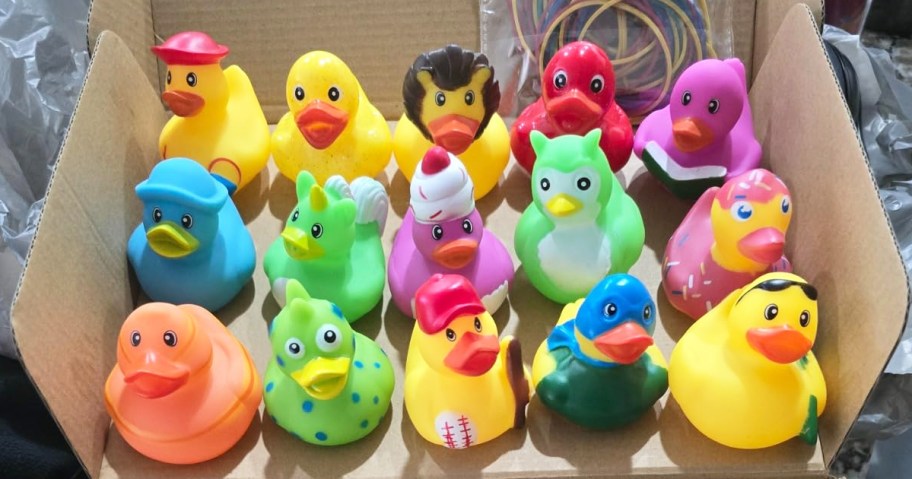 assortment of rubber ducks in cardboard box