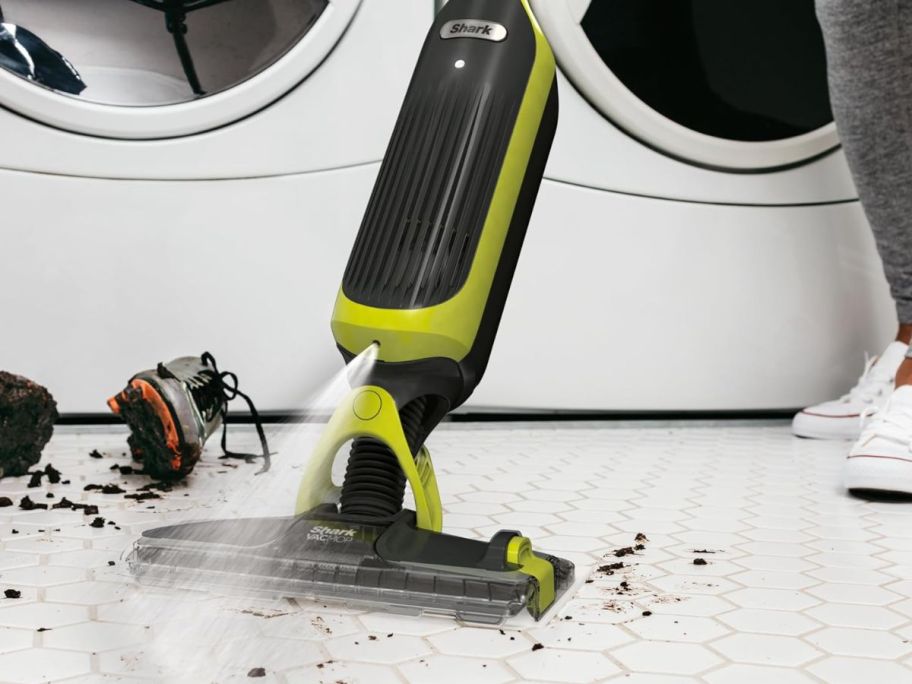 A Shark VACMOP spraying a floor