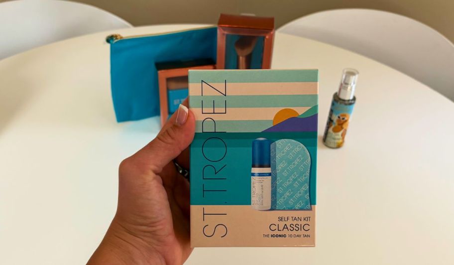 hand holding St tropez tanning kit