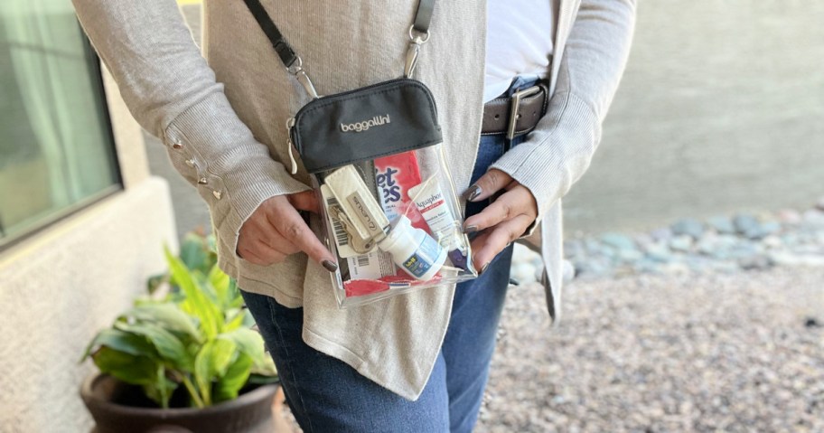 woman wearing a baggallini Clear Pocket Crossbody bag