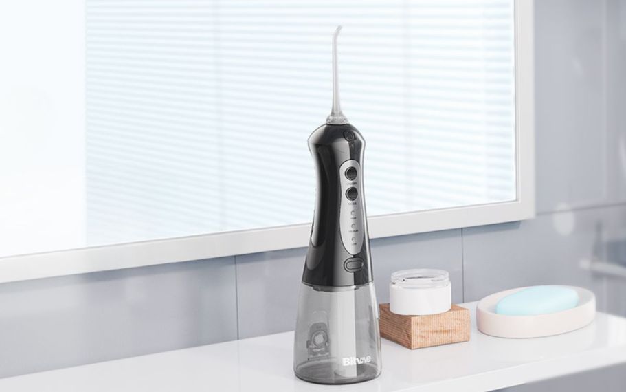 Cordless Water Flosser JUST $9.99 on Amazon | Includes 6 Replacement Heads & Tongue Scraper