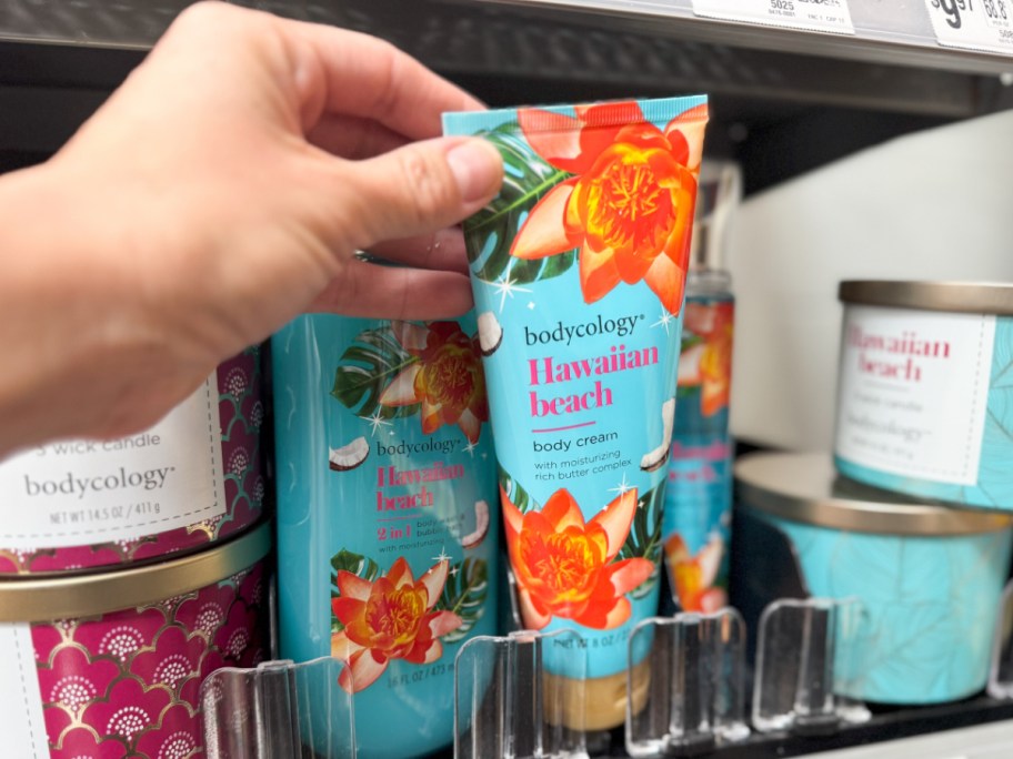 hand grabbing hawaiian beach lotion off shelf