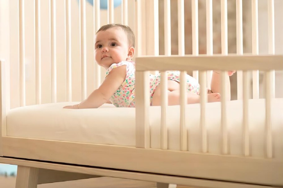 baby in neutral crib