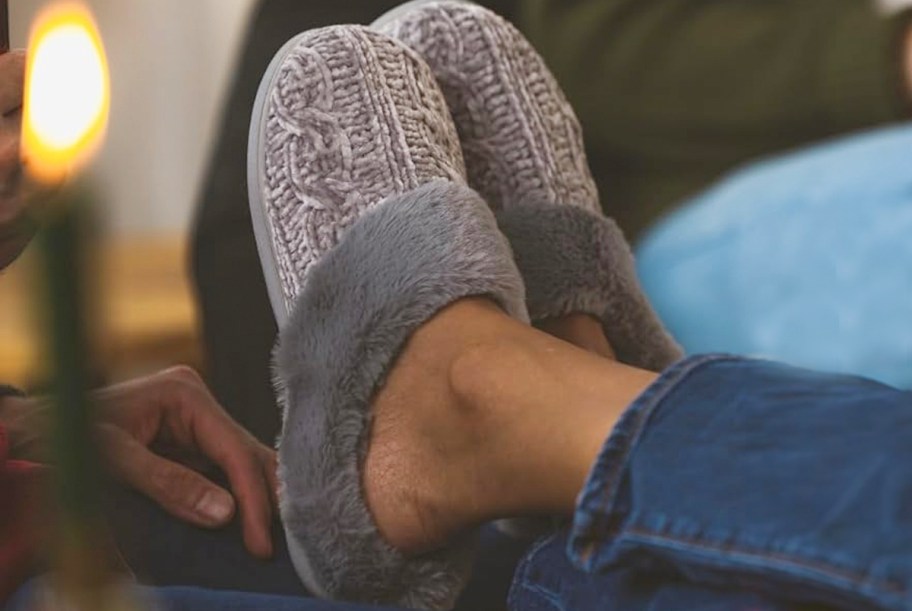 person wearing gray dearfoams slippers