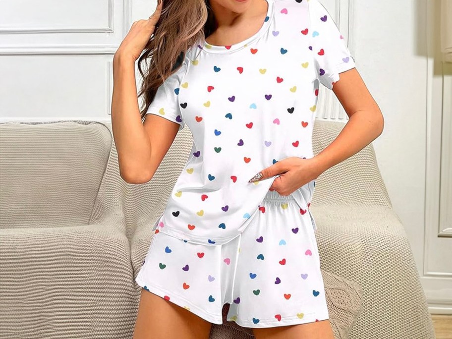 woman wearing white and heart pajama sets