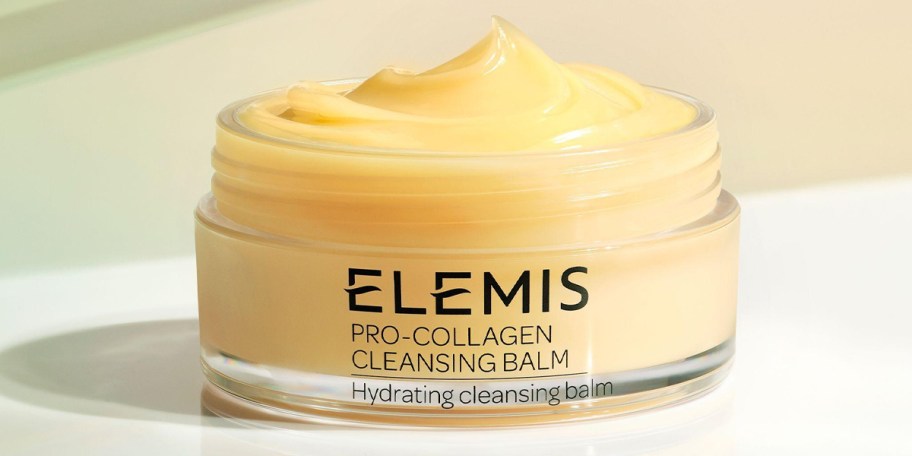 elemis pro collagen cleaning balm jar open on table