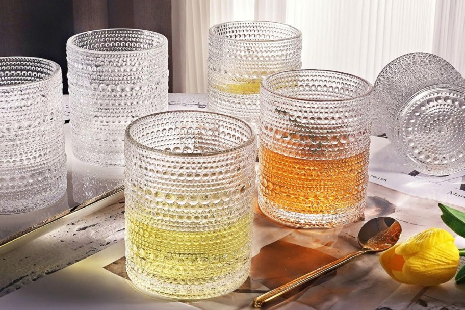 clear beaded glasses with liquid in them