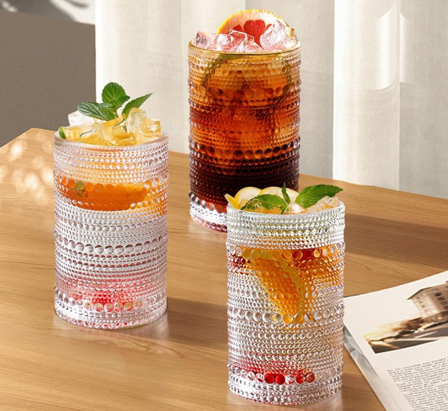 hobnail glasses with fruit cocktails in them