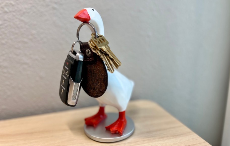 goose statue on desk with magnetic neck holding keys