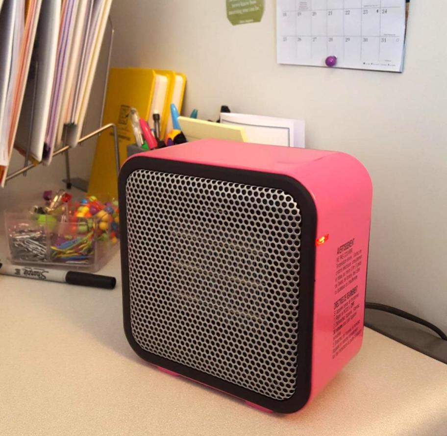 mini pink space heater on desk