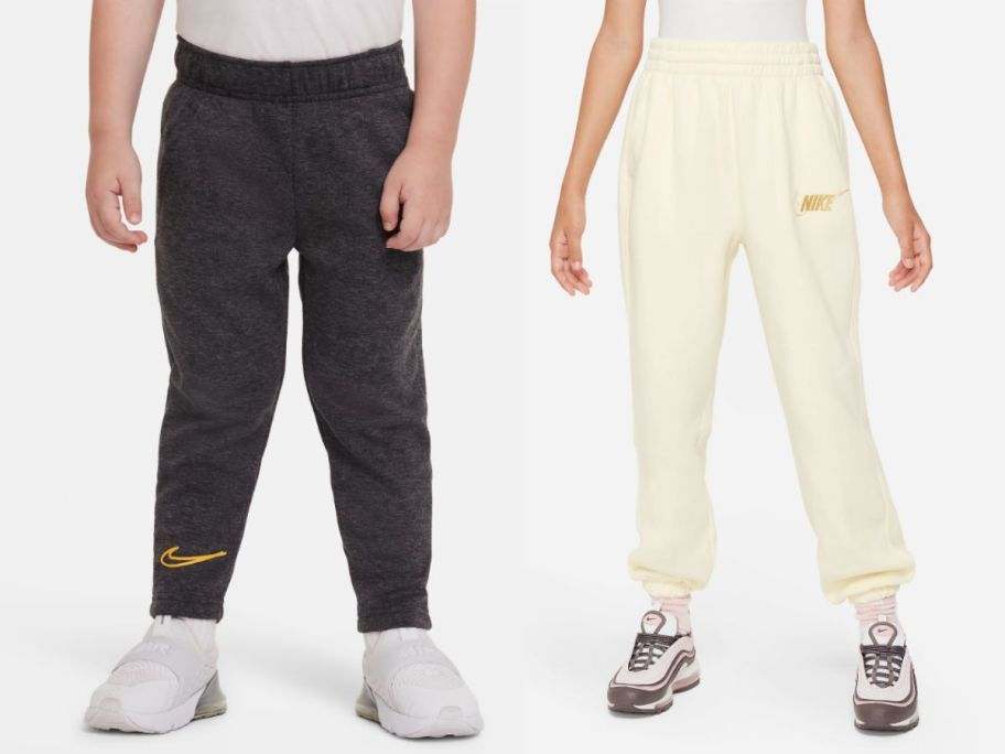 two kids wearing nike pants