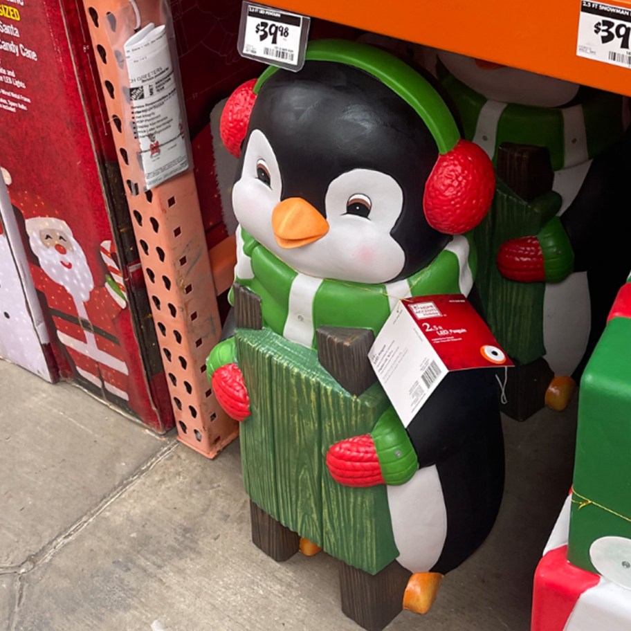 penguin wearing green scarf blowmold