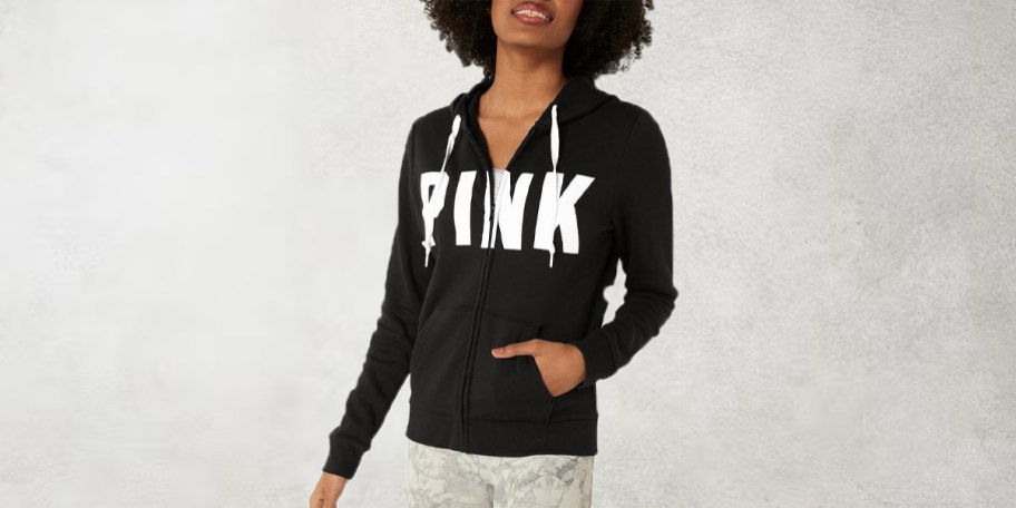 women wearing black pink hoodie