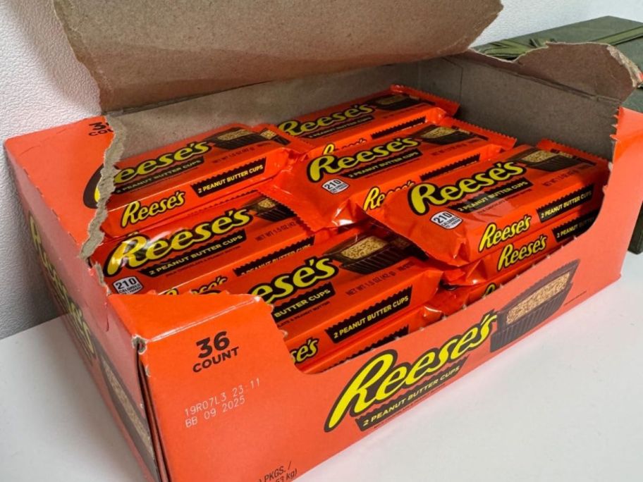 an open Reese's Peanut Butter Cups 36-Count box sitting on table