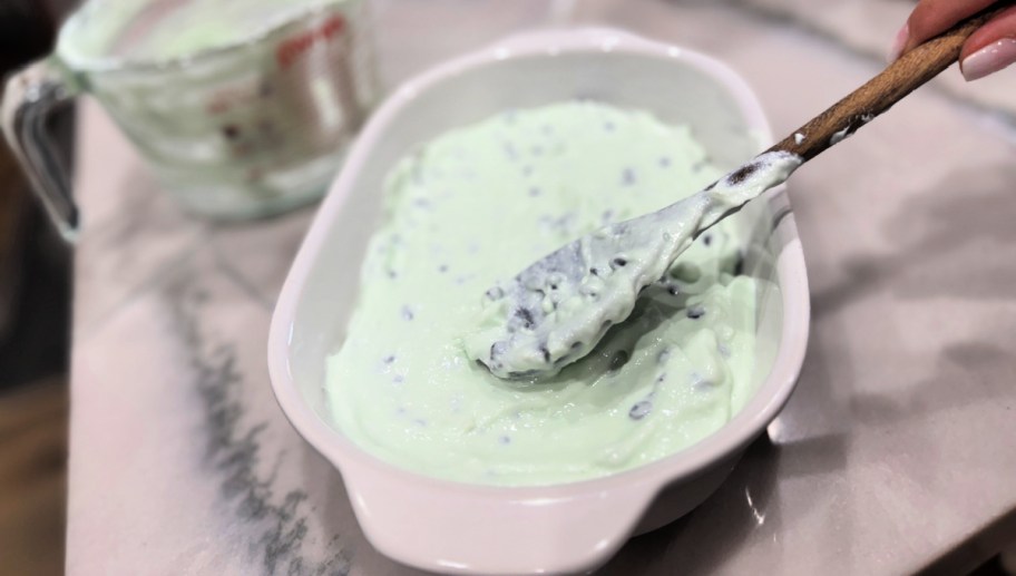 spreading high protein ice cream in a container