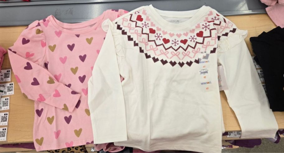two little girl shirts in valentines day prints