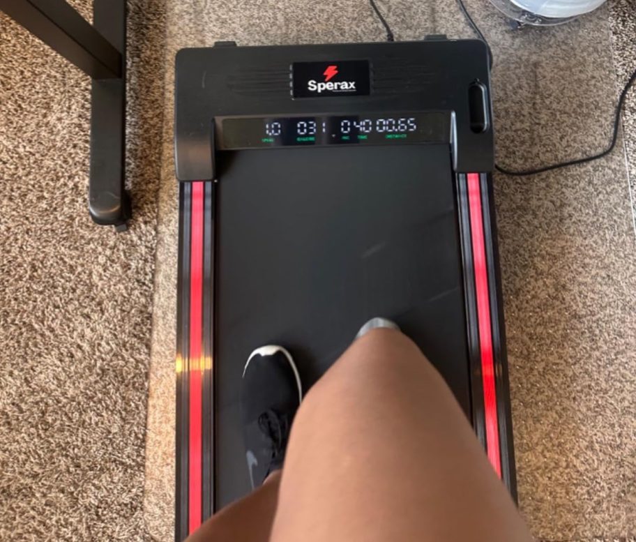 person walking on walking pad