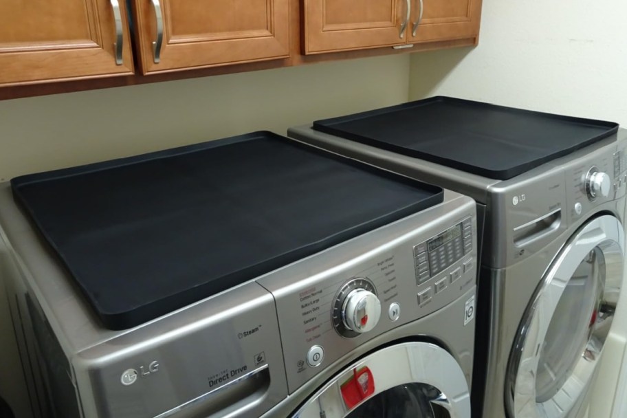 two black mats on washer dryer