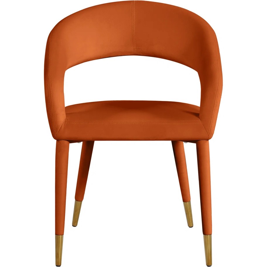 stock photo of rust colored velvet chair