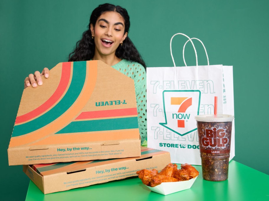 woman opening pizza box from 7-Eleven