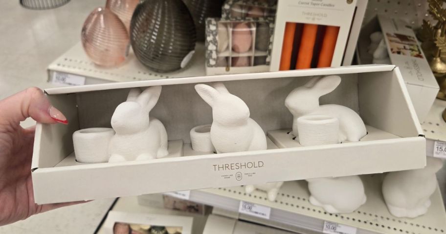 hand holding Bunny candle holders