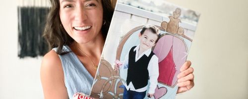Woman holding a Canvas Champ Canvas with a littl eboy on it