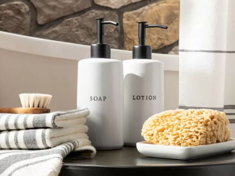 Hearth & Hand w/ Magnolia 3-Piece Stoneware Soap & Lotion Pump Set on table in bathroom