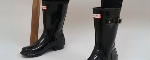 person wearing Hunter Women's Original Short Gloss Boots