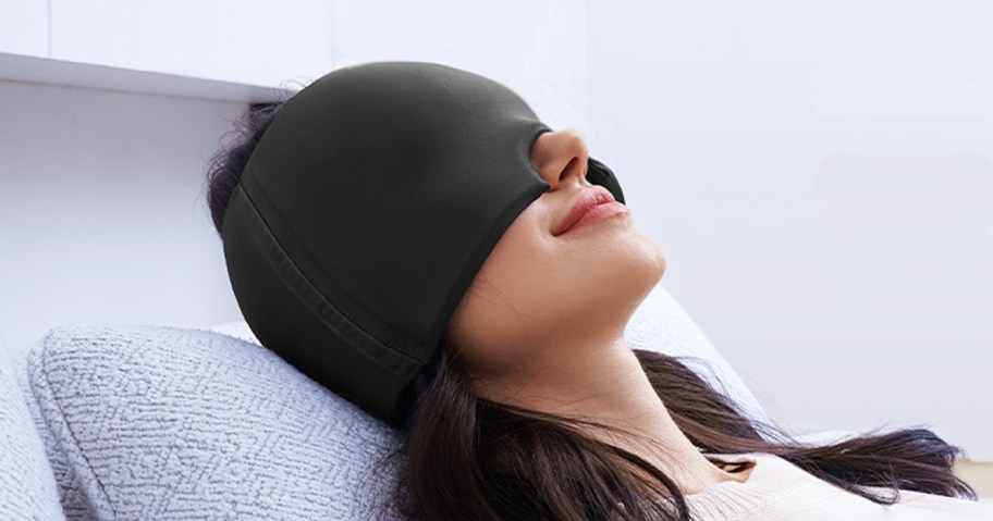 woman laying down with a Migraine Relief Cap on