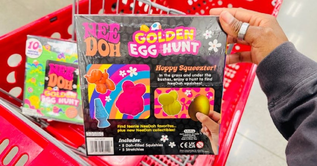 Person showing the backside of the Nee Doh Golden Egg Hunt