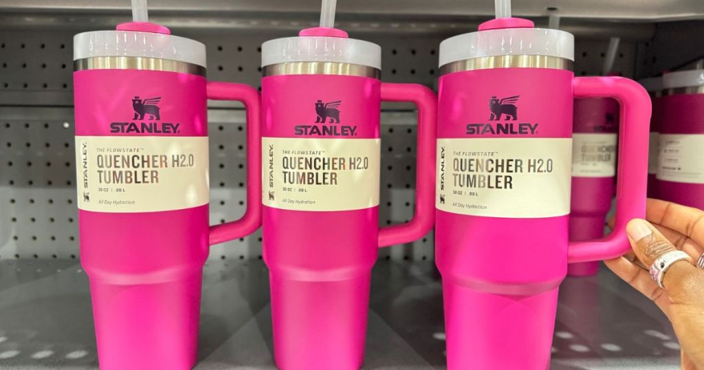 3 Hot Pink Stanley Tumblers on a store shelf