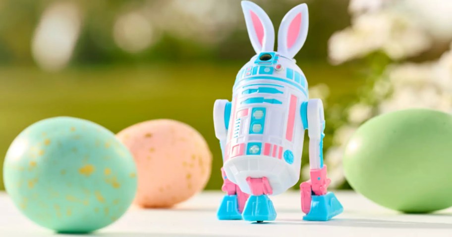 Blue and pink Star Wars bunny figure on table top next to Easter eggs