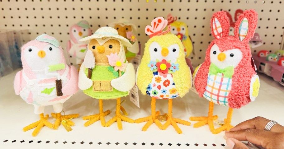 4 felt easter birds lined up on a store shelf