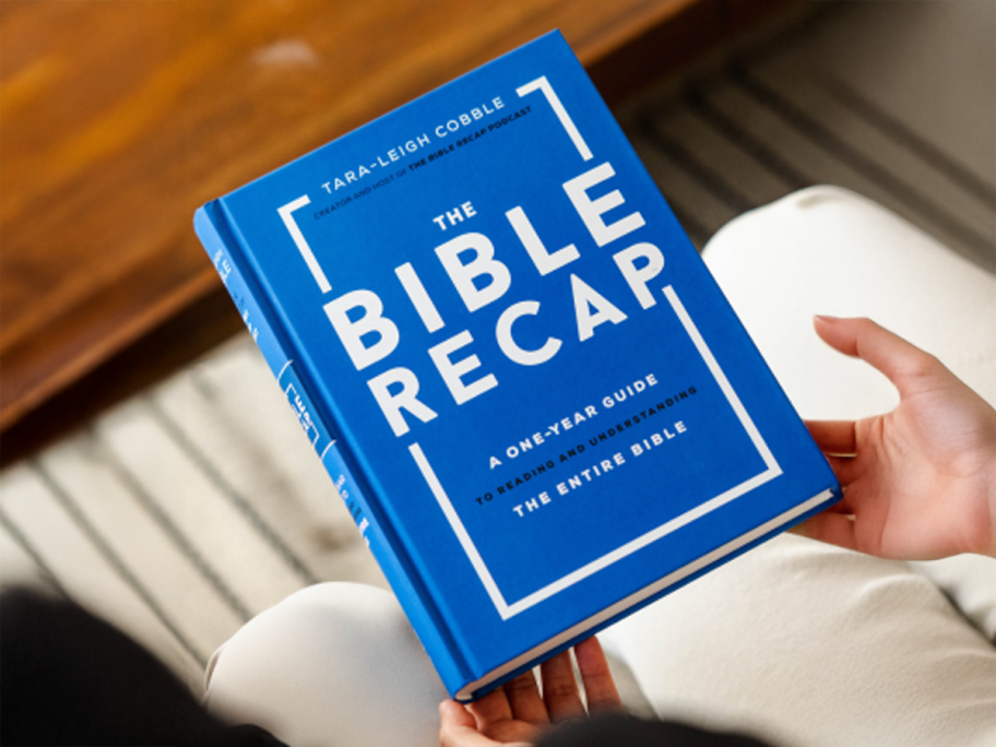 The Bible Recap Book being held